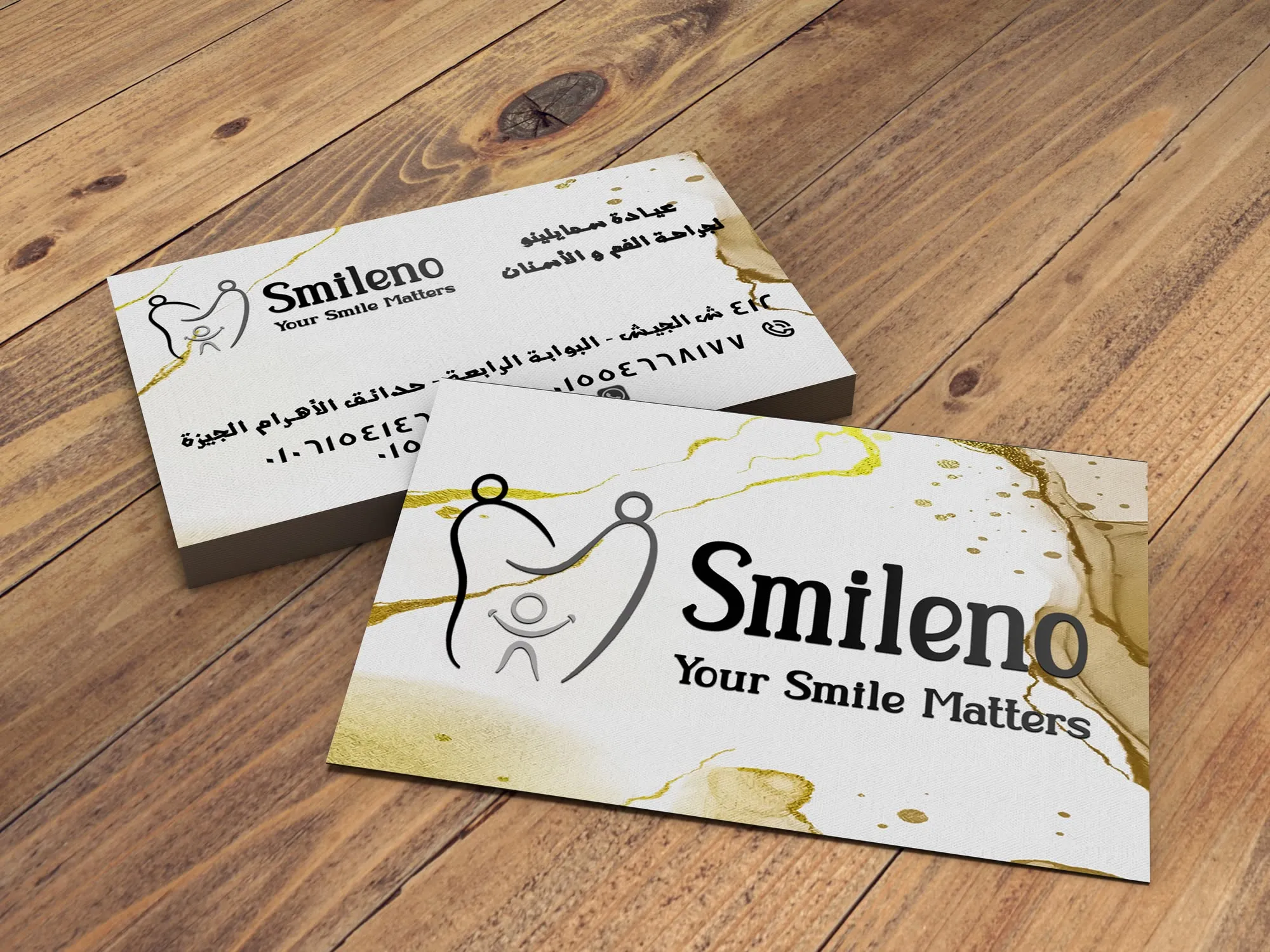 Bilingual business cards in the obsidian edition, black marble with gold veining, Arabic on the reverse